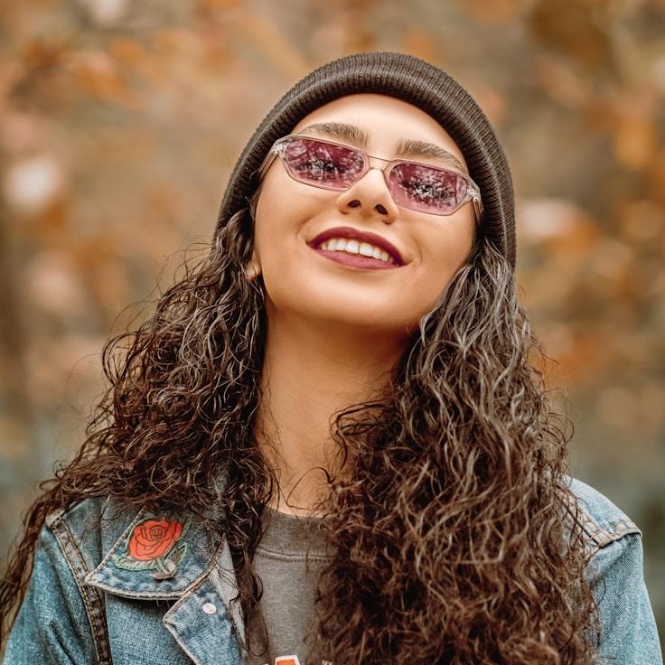 Maya Chen, Lead Design Curator at Lumin Exa Rovita, reviewing corporate floral arrangements